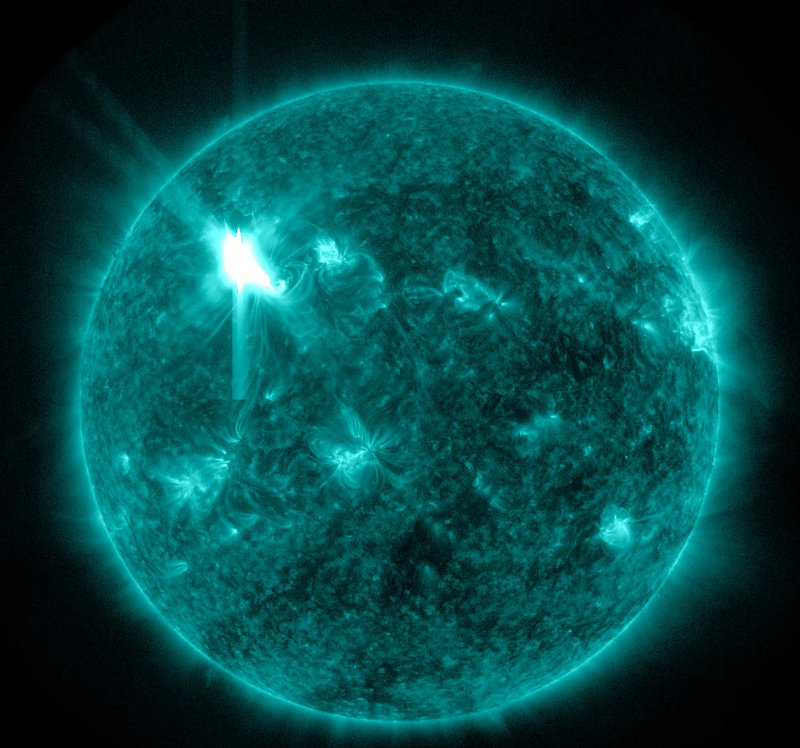 This extreme ultraviolet wavelength image provided by NASA enchances the depiction of a solar flare. A storm of charged particles from flares that erupted Tuesday night are hurtling toward Earth at 4 million miles per hour and are expected to hit today. Displays of northern lights could result.