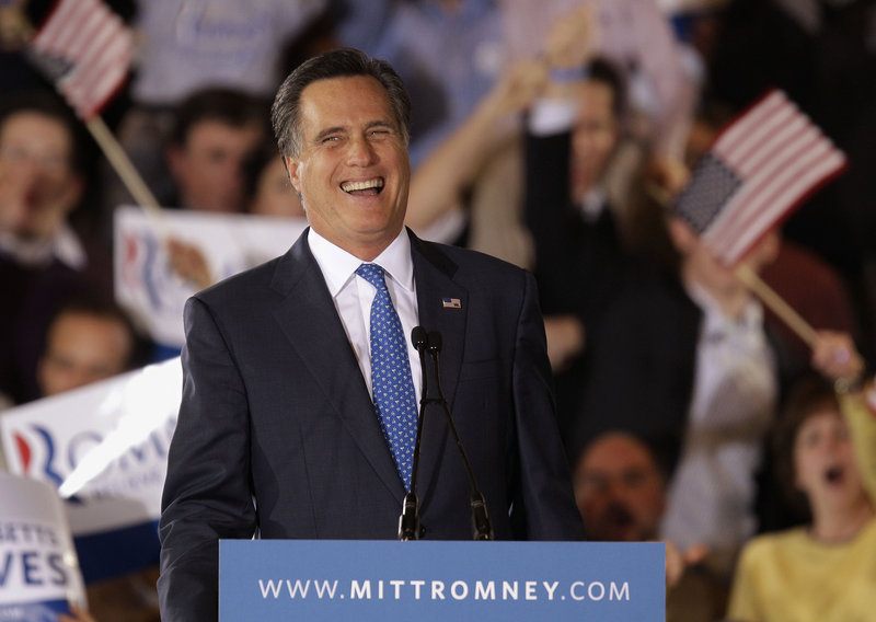 Republican presidential candidate Mitt Romney laughs while addressing supporters at his Super Tuesday campaign rally in Boston on Tuesday night.