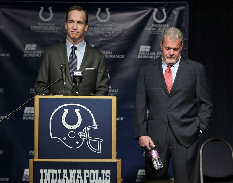 Peyton Manning speaks as Colts owner Jim Irsay listens on Wednesday. Manning and the Colts parted ways after 14 seasons, leaving Manning as a highly sought-after free agent.