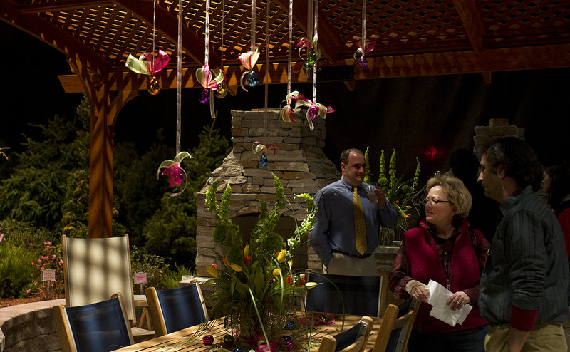Portland Flower Show visitors look at the Best in Show display from Jaiden Landscaping of Durham during the opening night gala Wednesday. The show, at the Portland Company complex on Fore Street, runs though Sunday.