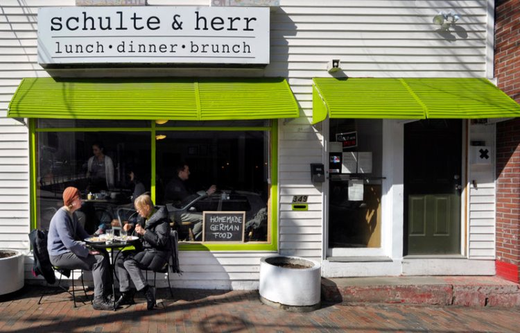 Annika Black of Bridgton, left, and her mother, Marlies Reppenhagen of Portland, dine on Schulte & Herr’s homestyle German food outside on a mild March day. The restaurant recently added dinner to its brunch and lunch offerings.
