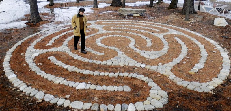 Deirdre McClure of Portland follows the path of a recently completed labyrinth at the University of New England’s Portland campus during an opening reception for the project Thursday. Intended as a meditative tool, the labyrinth, located behind the art gallery, was created by landscape architect Ethan Stebbins. “Walking the labyrinth can provide healing properties,” according to Cali Johnson, coordinator of UNE Counseling Services.
