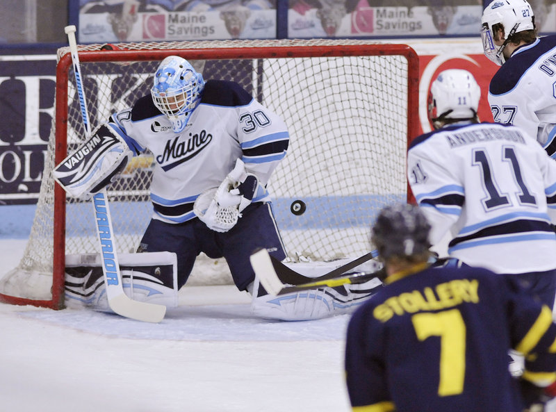 Dan Sullivan makes a save in the first period for UMaine during a 5-2 loss to Merrimack in the Hockey East playoffs Saturday night.