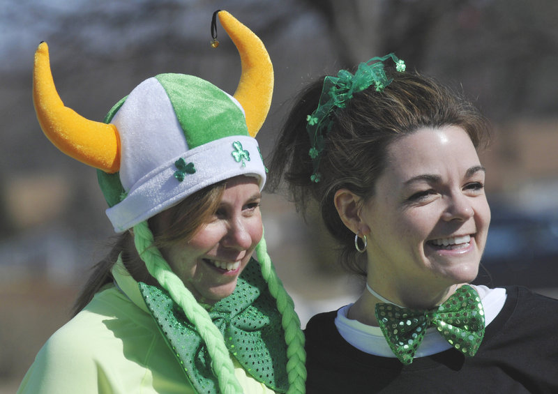 Vicki Pierson, left, of Westbrook and Kathy Caron of Gorham get in the spirit for Mary’s Walk.