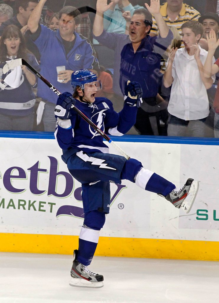Tampa Bay's Steven Stamkos celebrates his 50th goal, in the third period Tuesday night in Tampa, Fla. Stamkos scored twice in a 6-1 win over Boston.