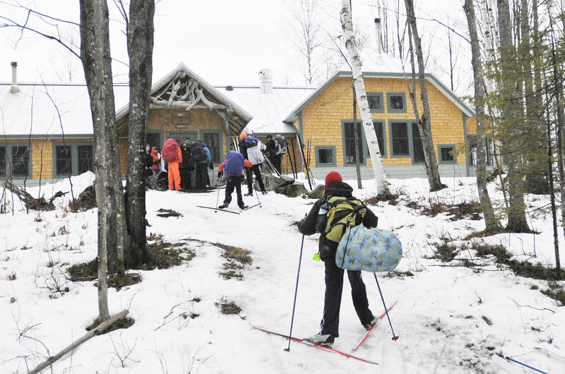 A group of students from North Yarmouth Academy arrives at the Flagstaff Lake Hut while skiing the Maine Huts & Trails system. Visitors have arrived from nearly every state and from as far as Dubai.