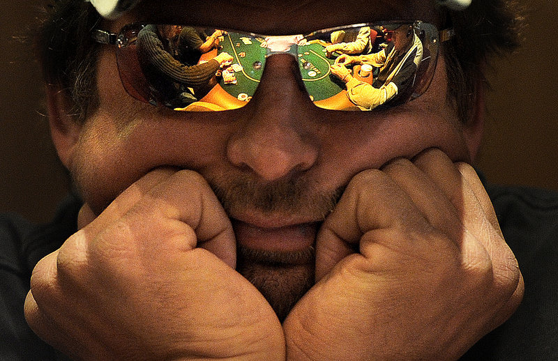 Keith Wickerson of Bradford plays a game of Texas Hold’em Friday at Hollywood Casino Hotel & Raceway in Bangor. There were 100 people playing mostly table games shortly after the casino opened Friday – its first day offering tables for poker, blackjack and roulette. Slot machines have been offered at the site since 2008.