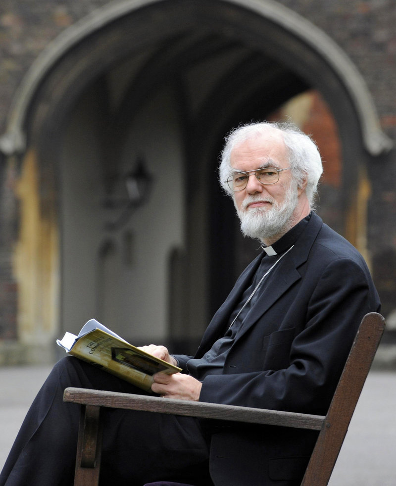 Archbishop of Canterbury Rowan Williams reads the Book of Common Prayer at Lambeth Palace in London on Friday. Williams says he is stepping down at the end of the year.