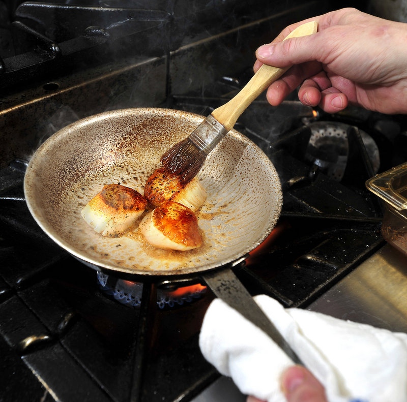 Walter’s chef/owner Jeff Buerhaus brushes his maple glaze on pan-seared scallops. Buerhaus starts the glaze with a good quality maple syrup, thins it a little with fresh lime juice, then adds cumin to taste.