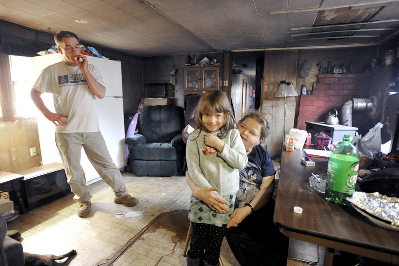 Robert Chapman and his sister Wendy Turner, and her 6-year-old granddaughter, Jadelynn Lee, seen here in their living room, were among the occupants during a home invasion in Steep Falls early Friday.