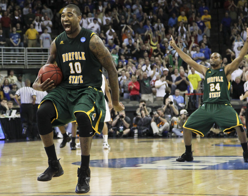 Kyle O’Quinn of Norfolk State celebrates Friday after his team pulled off a huge upset, knocking off second-seeded Missouri 86-84 at Omaha, Neb. The 15th-seeded Spartans will take on seventh-seeded Florida in the next round Sunday.