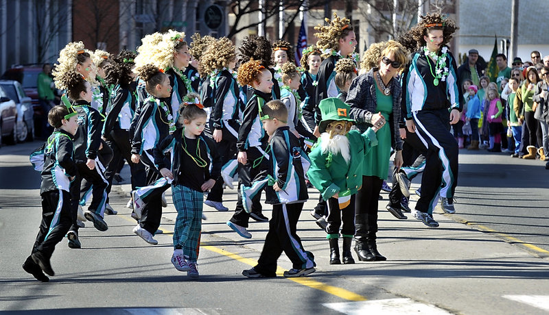 Members of the Stillson School of Irish Dance give a lift to parade watchers during the Irish American Club of Maine’s St. Patrick’s Parade along Commercial Street on Saturday. Other participants included members of the Portland Hurling Club.