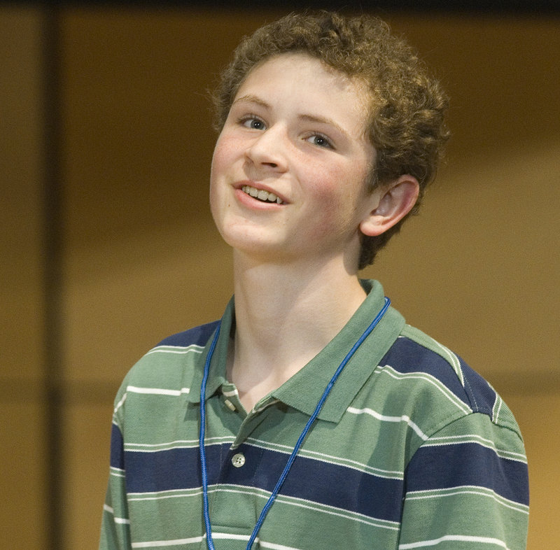 Third-place finisher Ben Philbrook, representing Aroostook County, smiles in frustration after misspelling a word late in the competition.