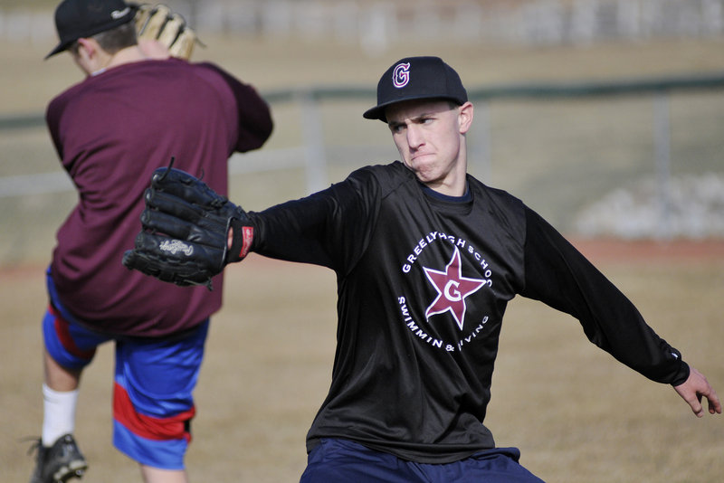 Connor Russell, a Greely pitcher, practices his technique during practice Monday in Cumberland.