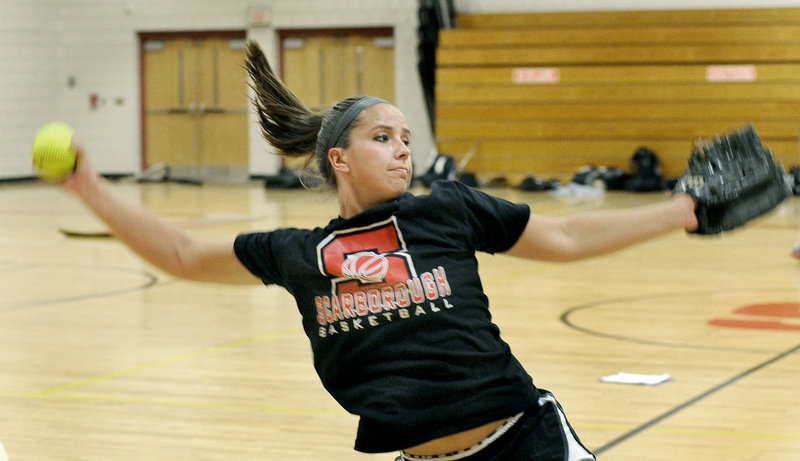 Erin Giles warms up at Scarborough High on Monday, the first day of spring practice. Giles is recovering from a knee injury and is excited to show her coach what she has been working on during the off-season.