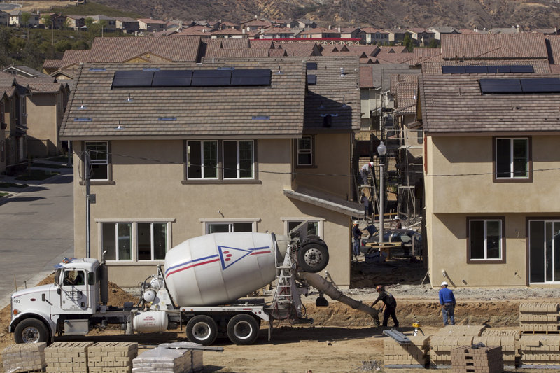 The construction company Lennar works on new single-family homes last week at the Aria at West Creek development in Santa Clarita, Calif. Compared with last year, 2012 is expected to be better for home construction.