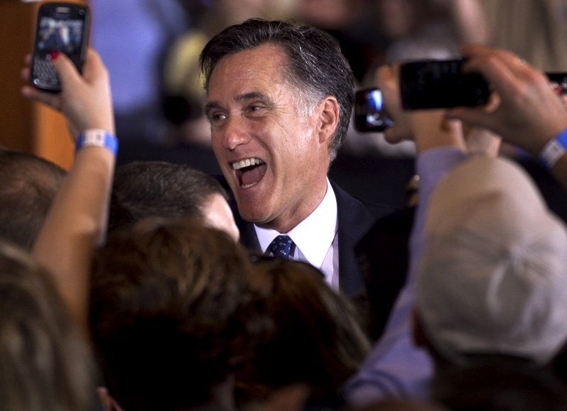 Republican presidential candidate, former Massachusetts Gov. Mitt Romney at a rally in Schaumburg, Ill., after winning the Illinois Republican presidential primary Tuesday.