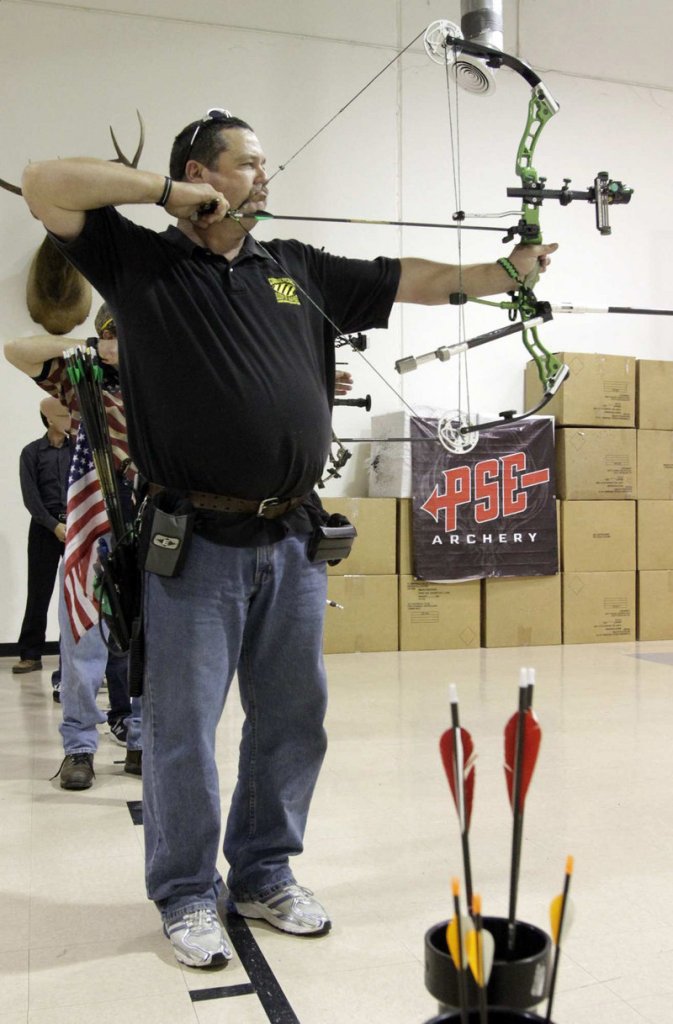 Archer Dennis Robbins on the shooting range at Hi-Tech Archery in Fullerton, Calif.