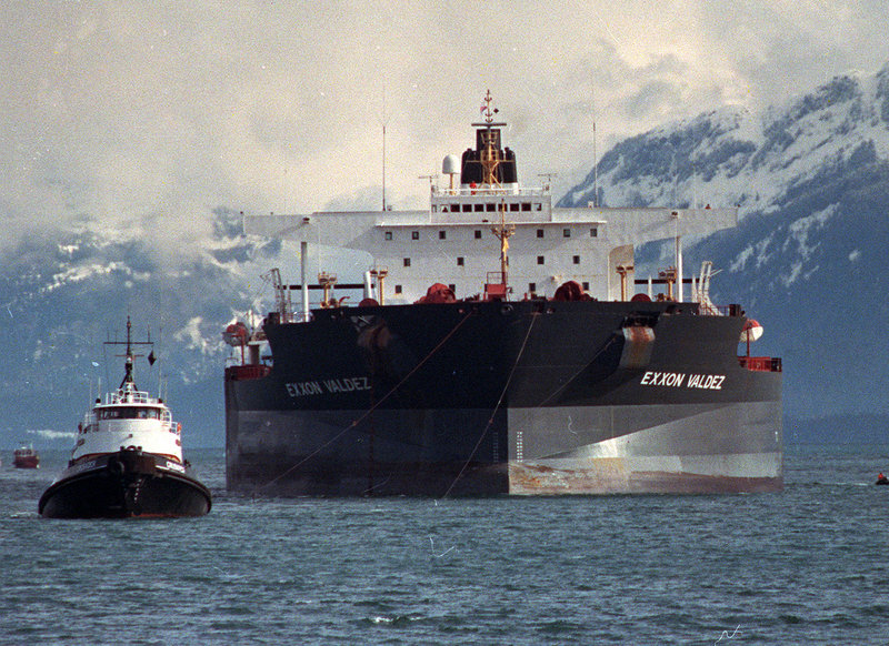 Tugboats pull the crippled tanker Exxon Valdez toward Naked Island in Prince William Sound, Alaska, in this April 5, 1989, file photo after the ship was pulled from Bligh Reef.