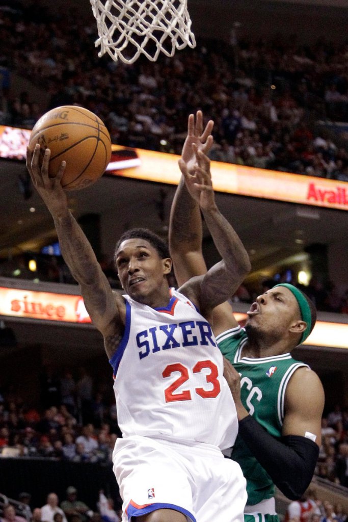 Lou Williams of the Philadelphia 76ers goes up for a shot against Paul Pierce of the Boston Celtics during the second half of the 76ers’ 99-86 victory Friday night.