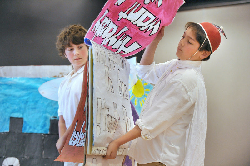 Ethan Carmolli changes his sign during his non-speaking role in the Edgecomb Eddy School’s team performance in the “Odyssey Angels” competition Saturday in Wells.