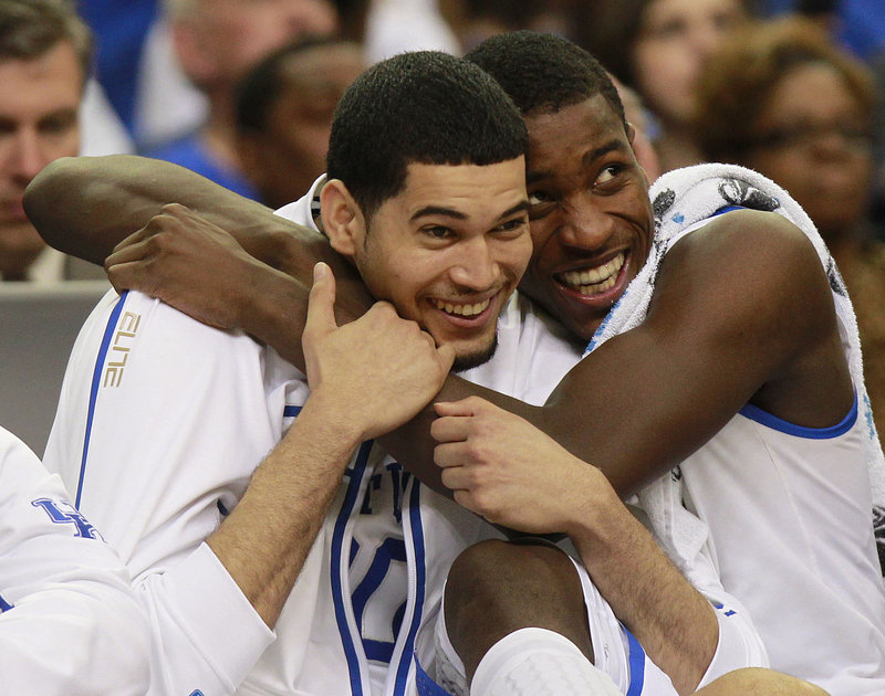 Eloy Vargas, left, and Michael Kidd-Gilchrist are simply giddy in the final seconds of Kentucky’s regional final win over Baylor Sunday in Atlanta.
