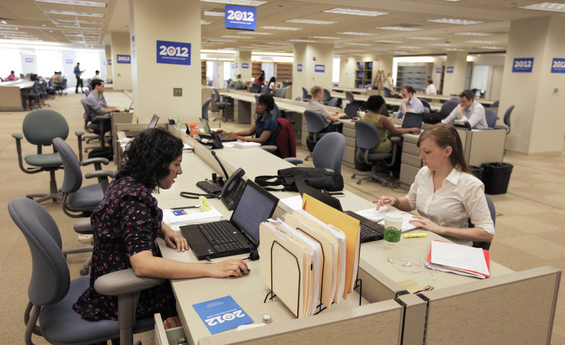 Staff members work at President Obama’s 2012 re-election campaign headquarters during a media tour of the then-new facility in Chicago last year. Obama maintains a campaign operation that is larger than any of his opponents’ organizations.