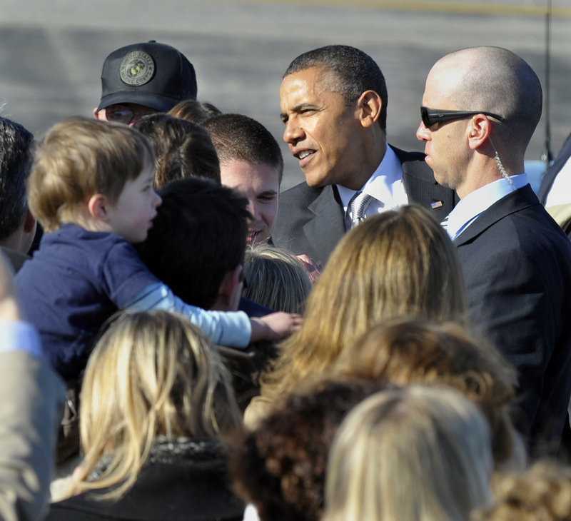 President Obama greets VIPs and their families Friday afternoon at Portland International Jetport. From there, the president headed to a fundraiser at Southern Maine Community College.