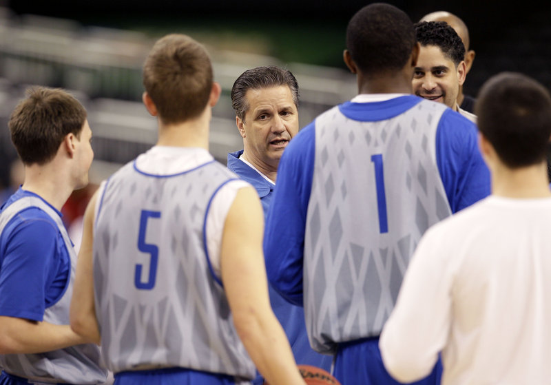 Coach John Calipari and his Kentucky Wildcats must get past Louisville today to earn a spot in the NCAA final.