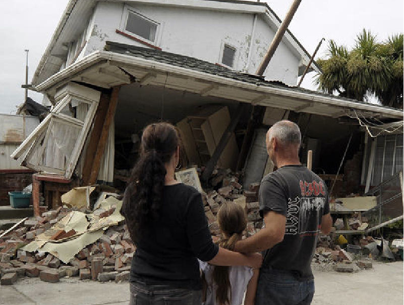 Maree, left, her daughter Jasmine, center, and Norm Butcher take a last look at their destroyed home in Christchurch, New Zealand, Saturday, after the city was hit by a 6.3 magnitude earthquake on Tuesday.