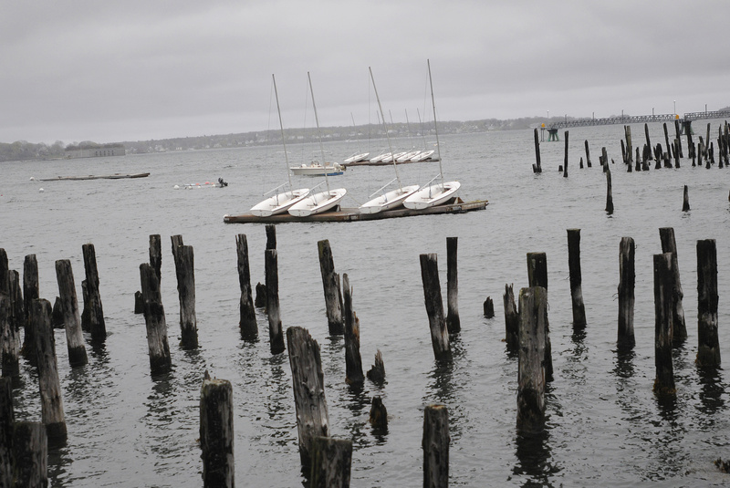 Boats sit on a dock in the choppy water on the eastern end of Portland Harbor on Sunday. The National Weather Service is calling for 2 to 3 inches of rain by the end of today.
