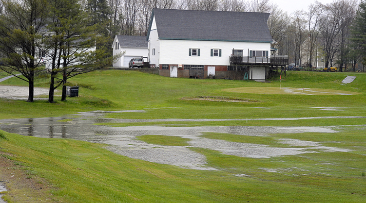No golf today at the Twin Falls Golf Club in Westbrook as heavy rains flood the course, making pools of water on the fairways and greens.