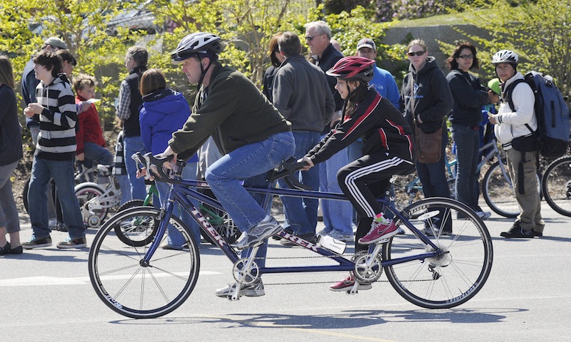 Alan Veilleux of Winslow and his daughter Desiree, 11, try out a tandem bicycle Sunday; they’re looking for one to ride in this year’s Trek Across Maine sponsored by the American Lung Association. This might be the one. “I like the seats,” said Desiree.
