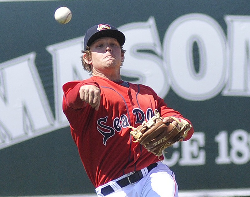 Zach Gentile, who joined the Sea Dogs about an hour before Sunday’s game from Class-A Salem, throws out a runner on a grounder to second at Hadlock Field.