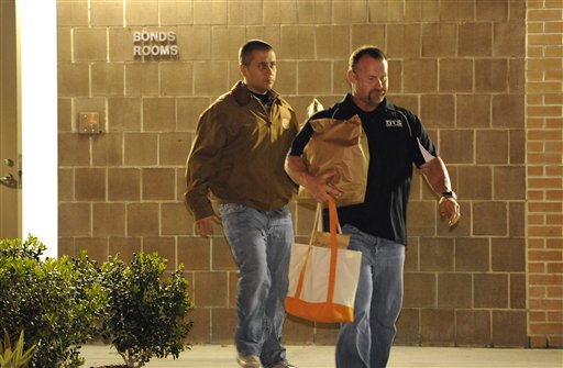 George Zimmerman, left, walks out of the intake building at the John E. Polk Correctional Facility with an unidentified man on Sunday in Sanford, Fla. Zimmerman posted bail on a $150,000 bond on a second-degree murder charge in the February shooting death of 17 year-old Trayvon Martin.