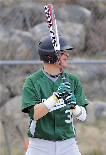 In this April 11, 2012 photo Oakmont Regioal High School's Dylan Poulin awaits a pitch during a game against Fitchburg High School, in Ashburnham, Mass. Poulin suffers from dilated cardiomyopathy, a condition in which the heart becomes weakened, enlarged and unable to pump blood efficiently. (AP Photo/Sentinel & Enterprise, Brett Crawford)