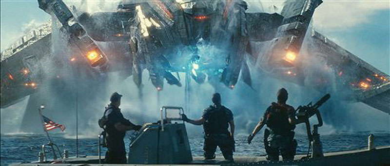 In this film publicity image released by Universal Pictures, from left, John Tui, Taylor Kitsch and Rihanna are shown in a scene from "Battleship." The Hasbro Inc. game using plastic pegs and ships was once a way for kids to while away lazy summer afternoons. But as it debuts in Europe on April 11, 'Battleship' the movie has become a potential franchise sporting Michael Bay-inspired special effects, aliens invading Earth, a bikini-model actress, superstar Rihanna and, of course, lots of guns. (AP Photo/Universal Pictures)