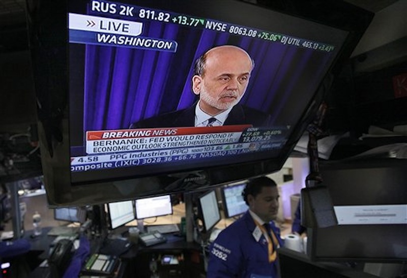 Federal Reserve Chairman Ben Bernanke is broadcast on a television screen on the trading floor of the New York Stock Exchange, Wednesday, April 25, 2012. Bernanke says further bond purchases by the Fed remain "very much on the table" if the economy needs further support. (AP Photo/Richard Drew)