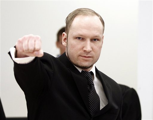 Accused Norwegian Anders Behring Breivik gestures on arrival at the courtroom, in Oslo, Norway, Wednesday April 18, 2012. Breivik has five days to explain why he detonated a bomb outside government headquarters in Oslo, killing eight people, then drove to a nearby resort island, where he massacred 69 others at a summer youth camp run by the governing Labor Party. (AP Photo/Lise Aserud/Scanpix Norway/POOL)