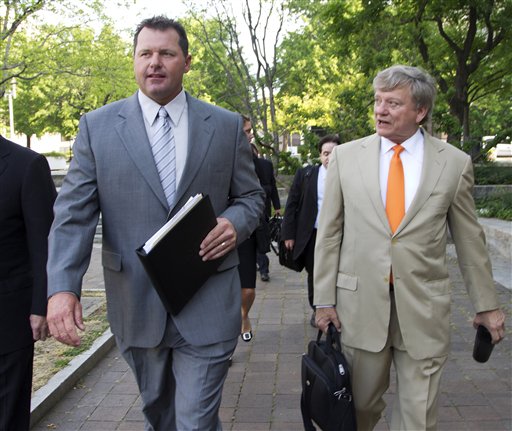 Former Major League Baseball pitcher Roger Clemens and his attorney, Rusty Hardin, arrive at federal court in Washington on Monday.
