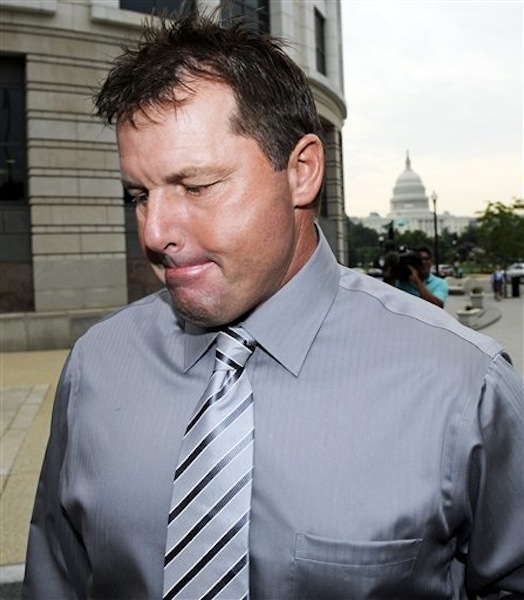In this July 6, 2011 photo, the Capitol is seen in the background, as former Major League Baseball pitcher Roger Clemens arrives at federal court in Washington. (AP Photo/Cliff Owen)