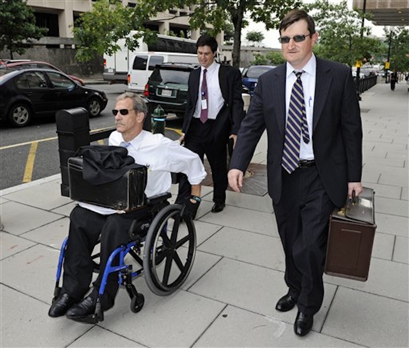 In this July 13, 2011 photo, Assistant U.S. Attorneys Daniel Butler, left, and Steve Durham, leave federal court in Washington. On a baseball field, players back up teammates to limit the damage from errors. The Justice Department, embarrassed by an error that caused a mistrial of Roger Clemens last year, has added more prosecutors in hopes of containing any missteps as it seeks to convict the famed pitcher of lying to Congress when he said he never used performance-enhancing drugs. (AP Photo/Cliff Owen)