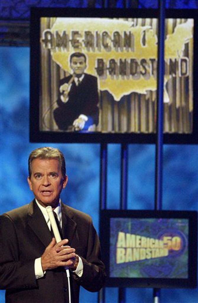 In this April 20, 2002 file photo, Dick Clark, host of the American Bandstand television show, introduces entertainer Michael Jackson on stage during taping of the show's 50th anniversary special in Pasadena, Calif. Clark, the television host who helped bring rock `n' roll into the mainstream on "American Bandstand," died Wednesday, April 18, 2012 of a heart attack. He was 82. (AP Photo/Kevork Djansezian, File)