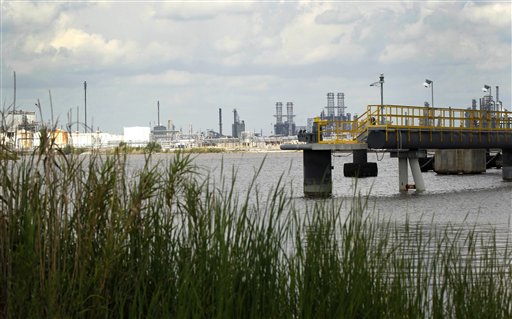 This photo taken April 13, 2012, shows a view of a plant near the approximate site of the former Olin-Matheison plant in Lake Charles, La. The view was originally photographed for the "Documerica" program, 1972-1977, instituted by the then-new Environmental Protection Agency, to document subjects of environmental concern.