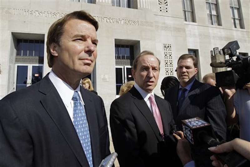 In this Oct. 27, 2011 file photo, former U.S. Sen. and presidential candidate John Edwards, left, speaks to the media with attorney Abbe Lowell, right, as he leaves the federal court in Greensboro, N.C. Prosecutors and defense lawyers in the John Edwards trial were poised Monday April 23, 2011 to begin making their case to jurors on whether the former presidential candidate violated federal campaign finance laws. (AP Photo/Chuck Burton, File)