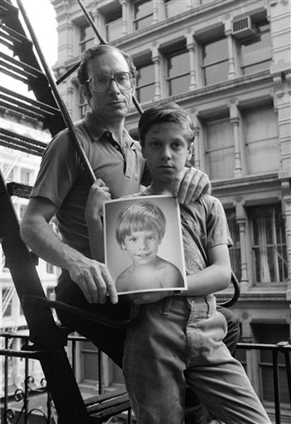 In this May 18, 1985 file photo, Stanly Patz, along with his son Ari, holds a photo of his son Etan, in New York. Etan Patz vanished in 1979 after leaving his family's SoHo home for a short walk to his school bus stop. On Thursday, April 19, 2012, investigators began searching a basement near the Patz's apartment for human remains of the boy. (AP Photo/Ron Frehm, File) abductions;children;crime;disappearance;family;kidnap;photo