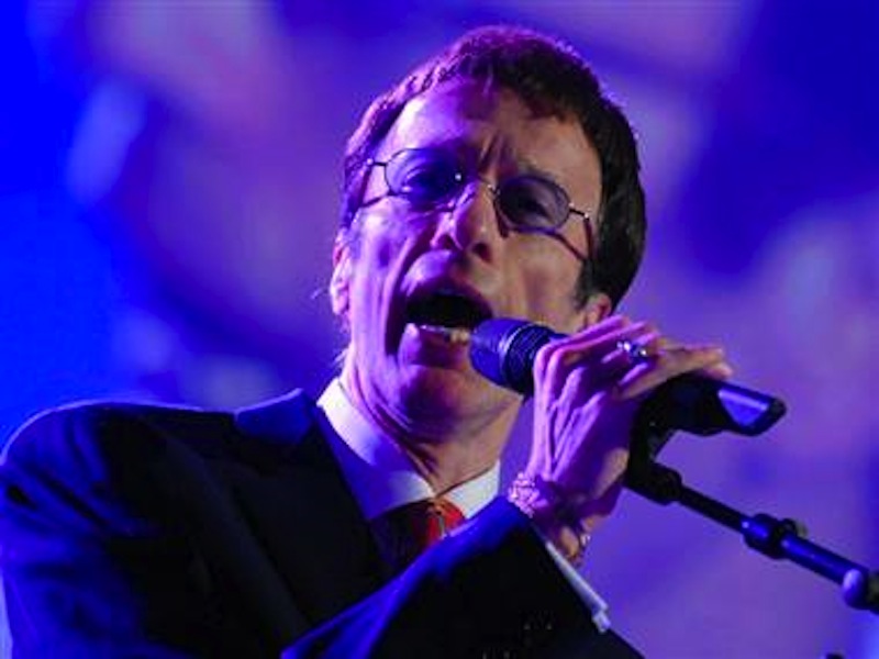 Bee Gees singer Robin Gibb, above, has awaken from a 12-day coma.