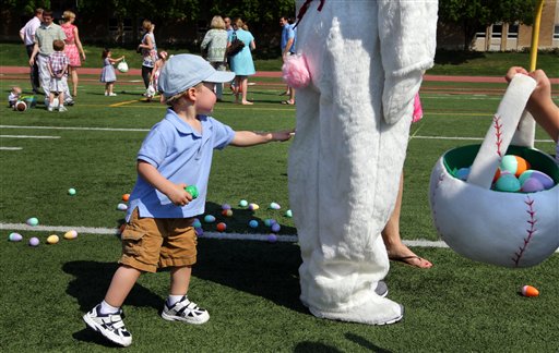 Ben Harvath, 1, of Brentwood, Mo., lets his curiosity get the best of him as he touches the Easter Bunny at an egg hunt Sunday in Creve Coeur, Mo. Ben Harvath;creve coeur mo;desmet jesuit high;Easter;post dispatch;robert cohen;spartans