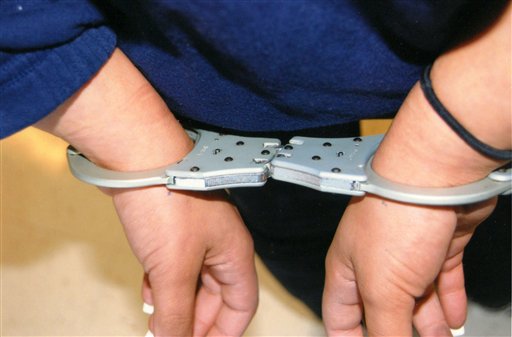 This undated image provided by the city of Albuquerque via Shannon Kennedy shows a school-aged juvenile handcuffed in Albuquerque, N,M. Whether it's ticketing students in Texas or handcuffing them from New Mexico to Massachusetts, experts say the criminalization of bad behavior at school is the outgrowth of zero-tolerance policies that have led to increased police presence in schools over the years.