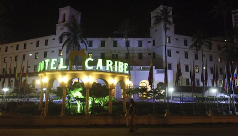 People walk past Hotel El Caribe in Cartagena, Colombia, late Thursday, April 19, 2012. Eleven Secret Service employees are accused of misconduct in connection with a prostitution scandal at the hotel last week before President Barack Obama's arrival for the Summit of the Americas. The identities of two Secret Service supervisors who have been pushed out of the agency in the wake of the scandal have been revealed. (AP Photo/Pedro Mendoza)
